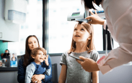 PXL_20240504_165906947 Image of child getting height measured in a health care setting.